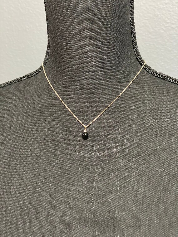 Single black pearl with small diamond sterling sil