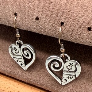 May include: A set of three ceramic mugs with a speckled, matte finish. Each mug is a different colour: light blue, cream, and grey. The mugs have a simple, modern design, ideal for coffee or tea.