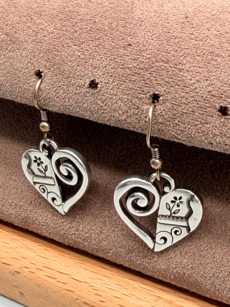 May include: A set of three ceramic mugs with a speckled, matte finish. Each mug is a different colour: light blue, cream, and grey. The mugs have a simple, modern design, ideal for coffee or tea.