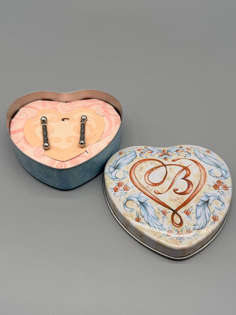 May include: A set of three ceramic mugs with a speckled, matte finish. The mugs are in shades of cream, light gray, and dark gray. Each mug has a simple, minimalist design, perfect for coffee or tea.