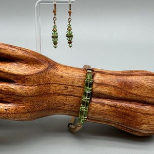 Lime green and gold tone bracelet and dangling earrings
