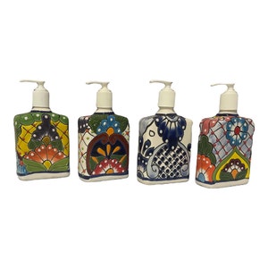 May include: Four ceramic soap dispensers with colorful Mexican Talavera designs. Each dispenser features a different pattern with blue, green, yellow, red, and white colors.