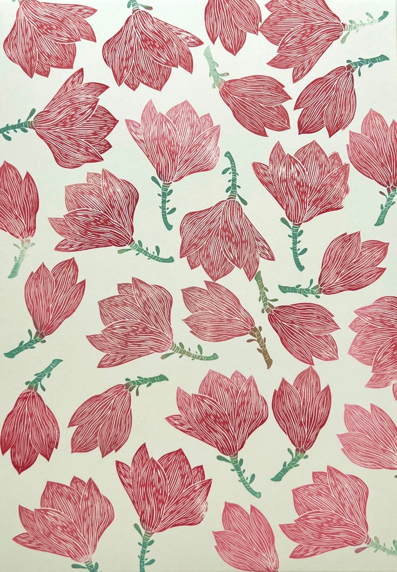 May include: A white background with a repeating pattern of pink magnolia flowers. The flowers are stylized and have a hand-drawn look.