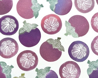 May include: A white background with a repeating pattern of purple and green mangosteen fruit. The fruit is illustrated in a vintage style with white outlines.