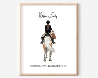 May include: A framed print with a black and white illustration of a person riding a horse. The text "Petina & Cody" is at the top of the print. The text "Your best friend doesn't always have to be human." is at the bottom of the print.