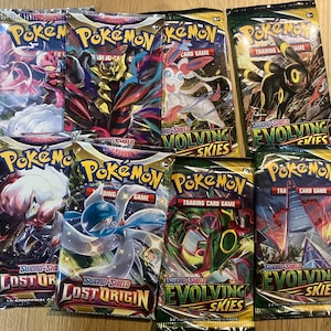 Pokémon-boosterpakket zwaard en schild evoluerende luchten verloren oorsprong huiveringwekkende heerschappij briljante winkels