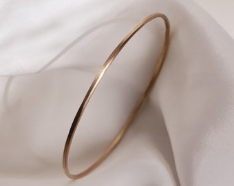 Minimalist solid gold bangle in recycled 9k yellow gold, Stackable Bangle with soft rustic textured, sustainably and eco consciously made