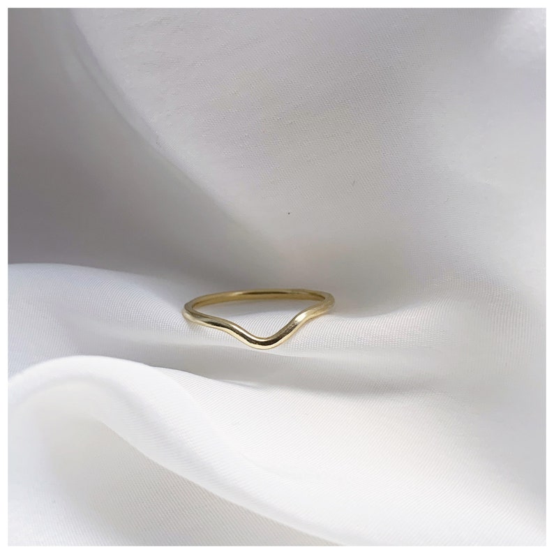 wave detail or curved wedding ring handmade to order in recycled golds by sustainable jeweller rebekah ann uk