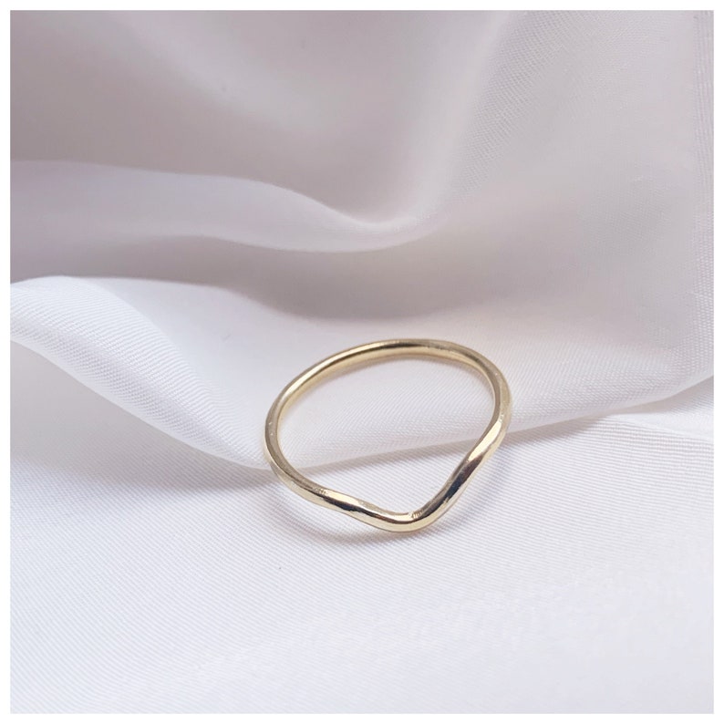 wave detail or curved wedding ring handmade to order in recycled golds by sustainable jeweller rebekah ann uk