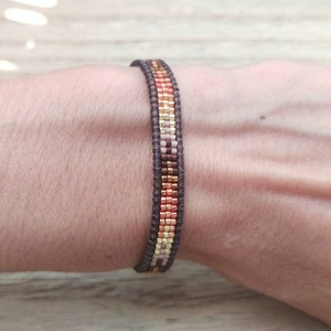 Bohemian bracelet woven by golden and copper seed bead for woman