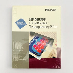 May include: A package of HP 51636F LX JetSeries Transparency Film for use with HP DeskJet and DeskWriter printers. The package features a photo of a transparency with a corporate sales chart printed on it. The package includes 50 transparencies, 8.5 x 11 inches.