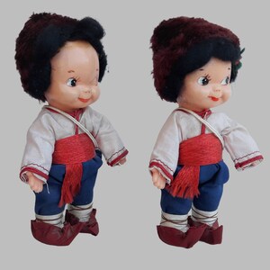 a pair of dolls of a boy and girl