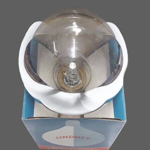 a white and blue box with a glass object inside of it