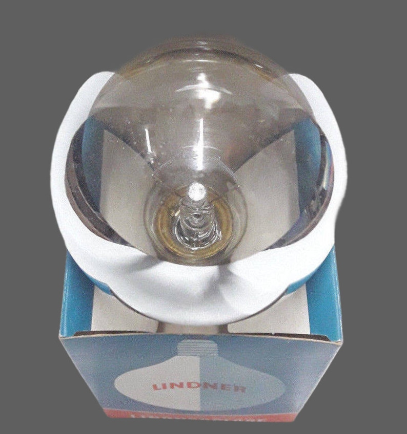 a white and blue box with a glass object inside of it