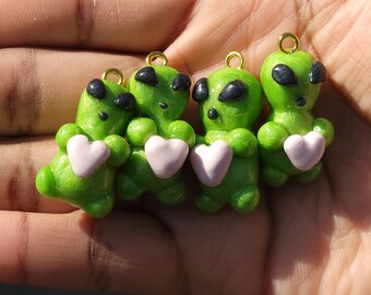 Cute Alien charms holding Hearts