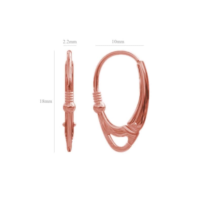 Rose gold leverback earrings.