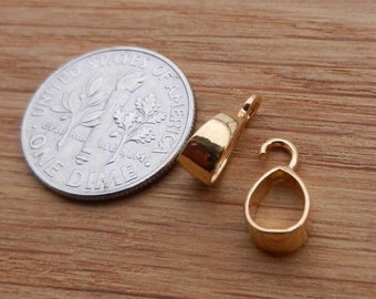 May include: Two gold-toned metal pendant bails, one with a loop and one with a hook, next to a US dime for size comparison.