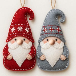 May include: Two felt Christmas gnome ornaments. One is red with white snowflake accents, the other is gray with red star accents. Both have white beards, rosy cheeks, and small noses. Each has a string for hanging.