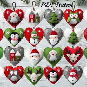 May include: A selection of heart-shaped felt Christmas decorations. Each decoration features a different festive design, including birds, houses, snowmen, Santa, owls, penguins, Christmas trees, and reindeer. The decorations are red, green, and grey with white accents.