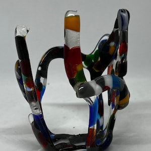 Palette; Modern fused art glass votive candleholder made with multicolored glass pieces.