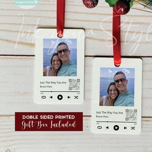 May include: Double-sided printed white ornament with a photo of a couple and a QR code. The ornament has a music player interface with the song "Just The Way You Are" by Bruno Mars. The text "Double Sided Printed Gift Box Included" is printed on the bottom of the ornament.