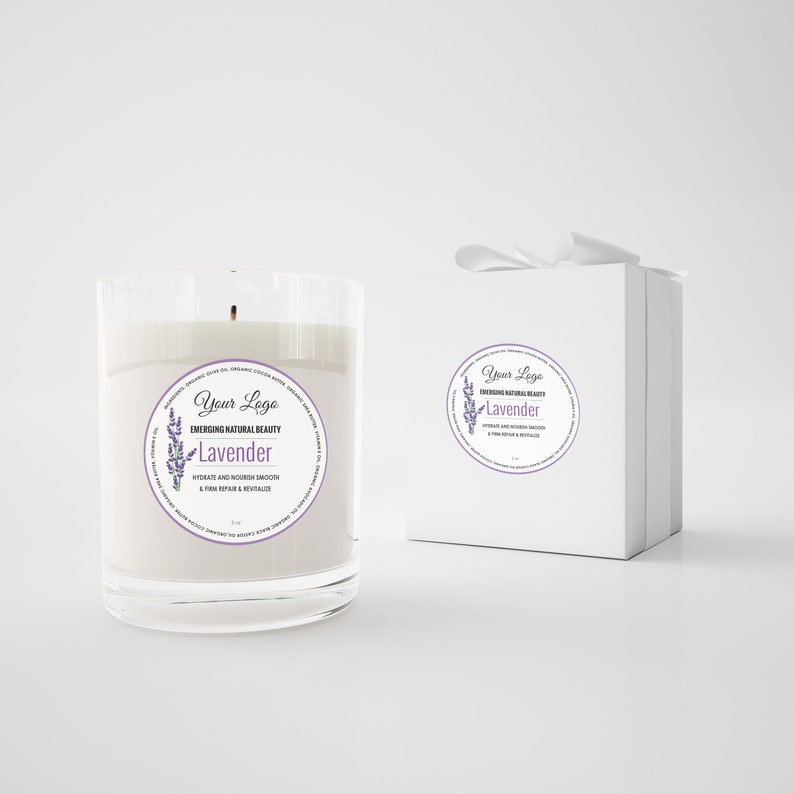 May include: A clear glass candle jar with a white candle inside. The jar has a round label with the text "Your Logo Emerging Natural Beauty Lavender Hydrate and Nourish Smooth & Firm Repair & Revitalize 2.2 oz".