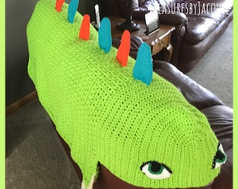 Crocheted lime green, orange and teal child’s hooded dinosaur blanket with claws and dermal plates.  Soft and snuggly blanket, cuddles, play