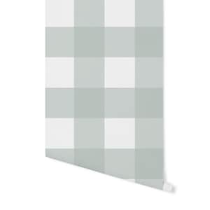 May include: A roll of wallpaper with a white and light green gingham pattern.