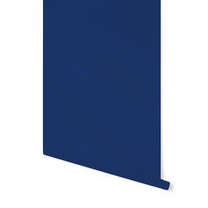 May include: A roll of dark blue wallpaper.