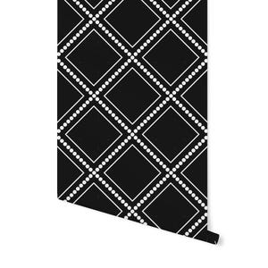 May include: Black and white wallpaper with a geometric pattern of diamonds outlined in white and dotted with white circles.