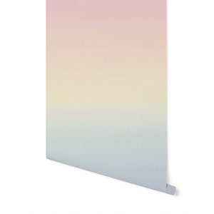May include: A gradient wallpaper with a pink, yellow, and blue color scheme. The wallpaper has a subtle texture and a smooth finish.