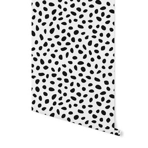 May include: Black and white dalmatian print wallpaper with a repeating pattern of black spots on a white background.