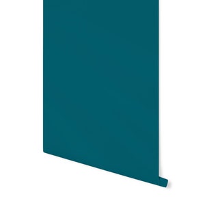 May include: A roll of teal blue wallpaper with a slight curl at the bottom.