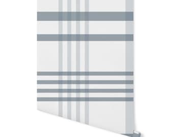 May include: White and light blue plaid wallpaper with a subtle pattern. The wallpaper is rolled up and ready to be hung.
