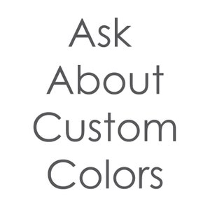 May include: Text that reads "Ask About Custom Colors" in a gray font on a black background.