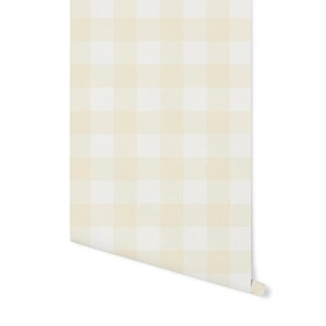May include: A roll of white and cream gingham wallpaper with a subtle texture. The wallpaper has a classic checkered pattern.