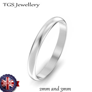 May include: A simple silver wedding band with a smooth, polished finish. The band is available in 2mm and 3mm widths.