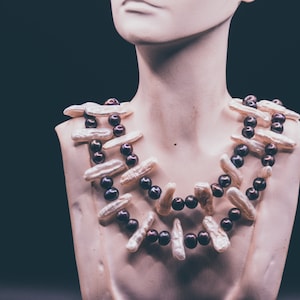 Natural baroque seed white pearls and fresh water cultured round pearl twin strand black/white necklace