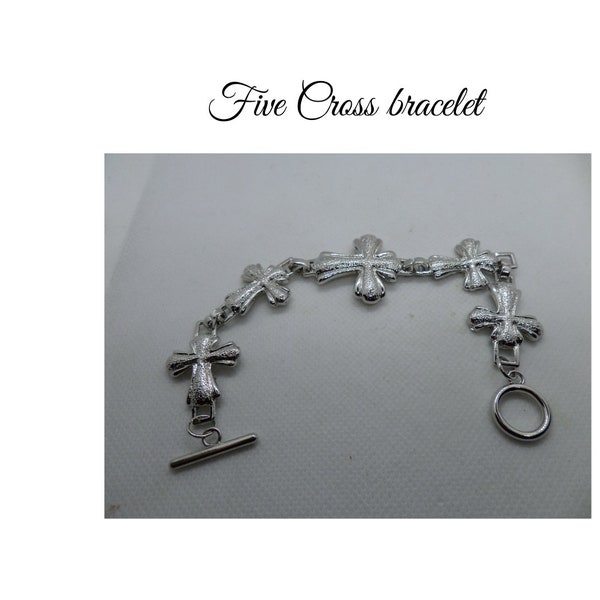 Five cross silver linked bracelet. Silver plate weighted cast strength. Impressive piece of costume jewellery.