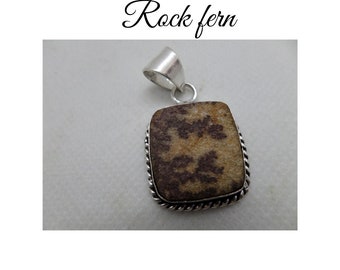 Natural Rock Earth tones fern feature stone pendant. Beautifully framed in rope patterned sterling silver 925 stamped.