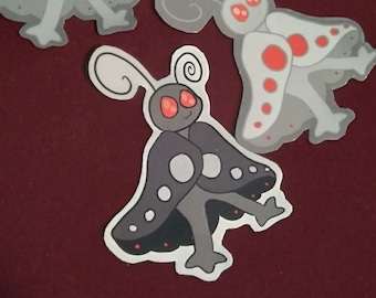 Puede incluir: Tres pegatinas de mariposas grises y blancas con manchas rojas. Las pegatinas tienen un mensaje escrito a mano que dice "Mantente seguro, mantente amable, mantente raro."