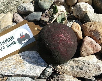 Black Mothman Bath bomb (2.75 Inch, 8 oz.) w/ Red eco-Glitter, shea butter, mica powder - Fragrance: Violet, Pomegranate, Sandalwood