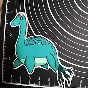 Loch Ness Monster sticker - cute cryptid sticker of Nessie with seaweed