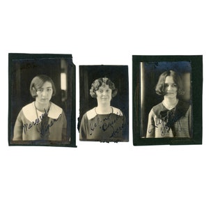 May include: Three vintage black and white photographs of women, each framed in a dark border. Each woman is wearing a collared dress and has a handwritten signature below their image. The photographs are likely from the early 20th century.