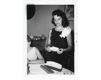 Not a Fan ~ 1950s Vintage Snapshot ~ Woman Looking at Wedding Garter ~ Candid Vintage Photo S65