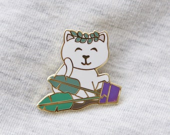 Cat knocking over a plant hard enamel pin