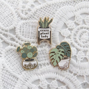 plant lapel enamel pins (1 inch tall) - monstera deliciosa, pilea pepperomide, crazy plant lady snake plant, mid century plant stand