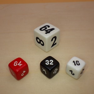 May include: Three dice with numbers 64, 32, and 16. The dice are white, black, and red.