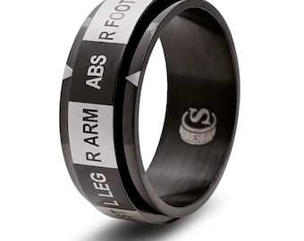 May include: Black spinning ring with white lettering that reads "L LEG R ARM ABS R FOOTL HA".