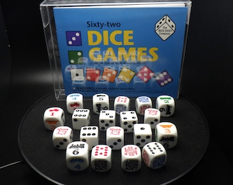May include: A set of 12 white dice with various colorful designs and numbers. The dice are in a clear plastic box with a blue and white label that reads "Sixty-two Dice Games 12 Unique Games Plus 10 State Games". The label also includes the text "The Nice Dice Company".